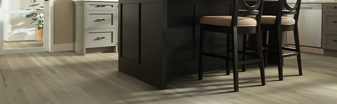 light Laminate flooring in kitchen with island 